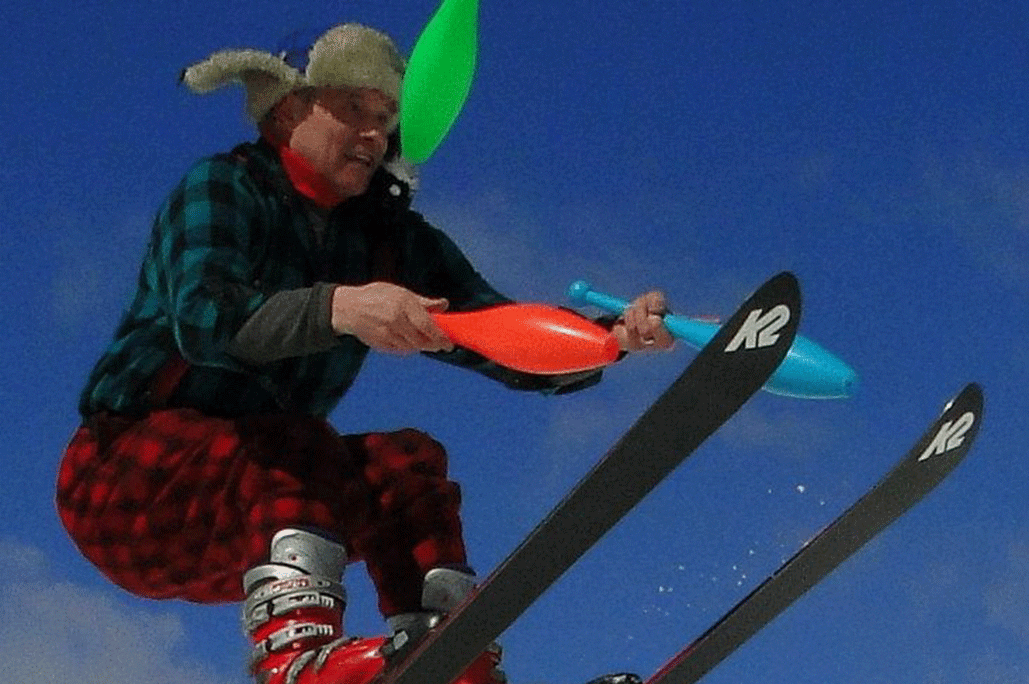 Tommy Tropic juggles colorful plastic bowling pins while hitting a ski jump at Treetops Resort.